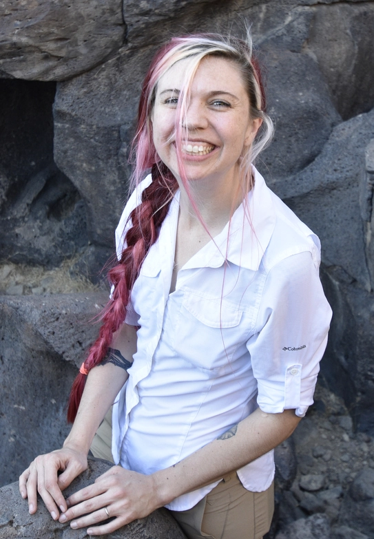 Alyssa smiling in the field